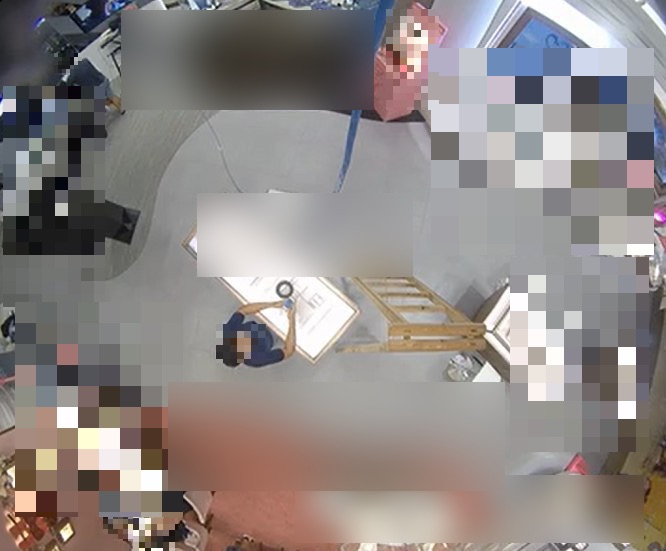 Heavily redacted still from a live internal CCTV feed reachable from outside the client network.